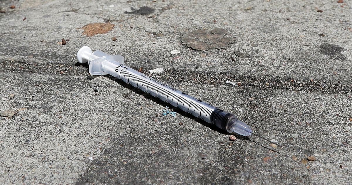 A used syringe is seen on a sidewalk in San Francisco on May 10, 2018.