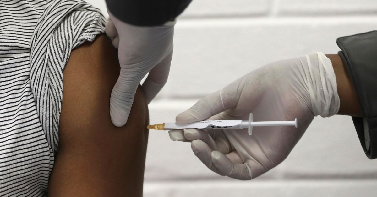 A volunteer receives an injection of the University of Oxford-AstraZeneca vaccine at the Chris Hani Baragwanath hospital in Soweto, Johannesburg, on June 24.
