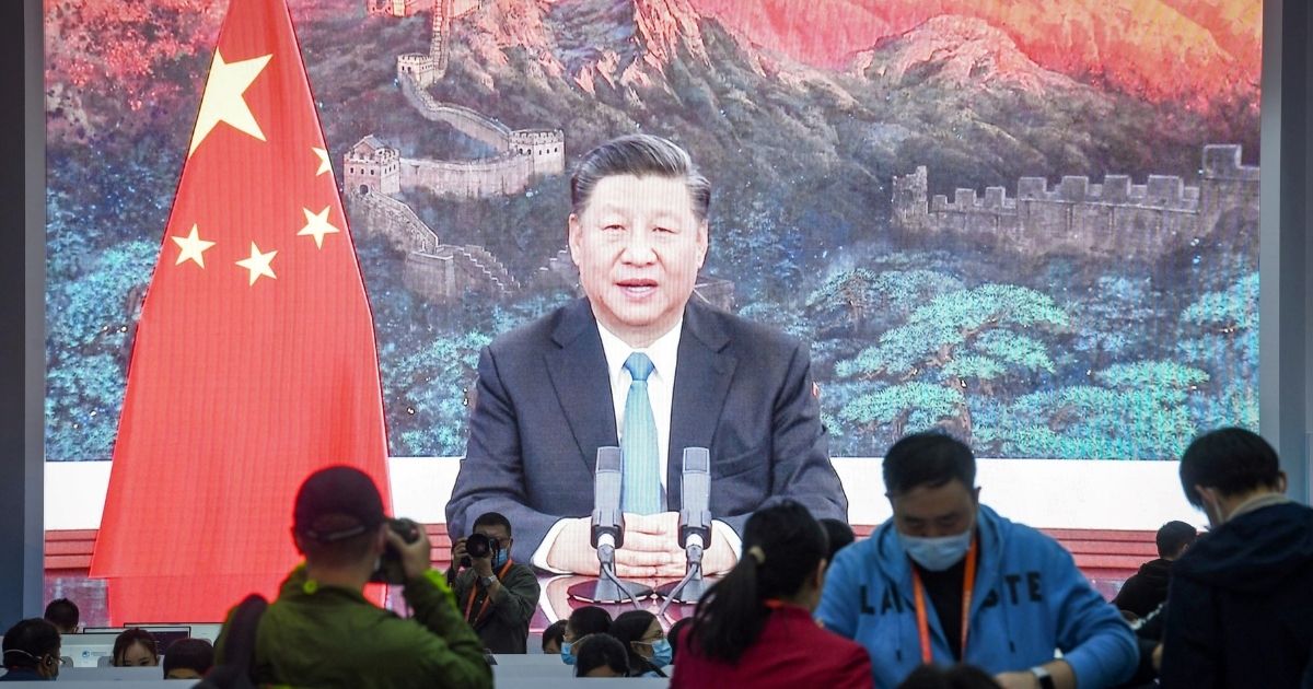A screen shows Chinese President Xi Jinping delivering a speech via video for the opening ceremony of the 3rd China International Import Expo (CIIE) at a media centre in Shanghai on November 4, 2020.