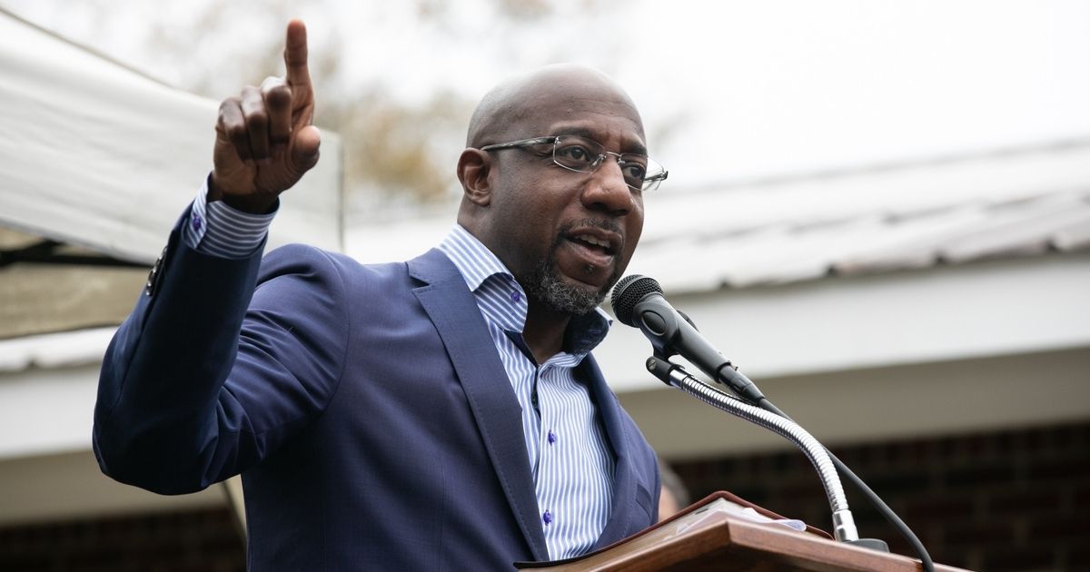 Democratic Sen. candidate Raphael Warnock speaks to church members during a drive-up worship service at St. James Missionary Baptist Church on Sunday in Columbus, Georgia.