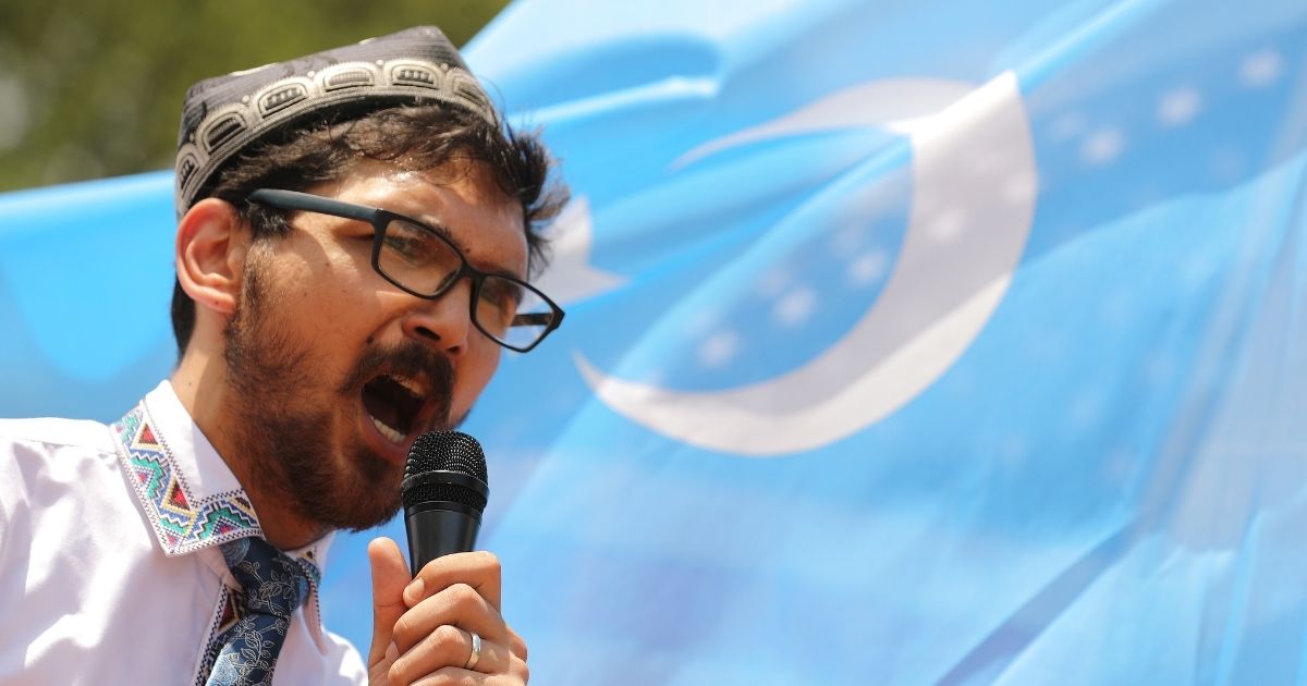 Salih Hudayar, founder of the East Turkistan National Awakening Movement, leads a rally outside the White House to urge the United States to end trade deals with China and take action to stop the oppression of the Uighur and other Turkic peoples Aug. 14, 2020, in Washington, D.C.