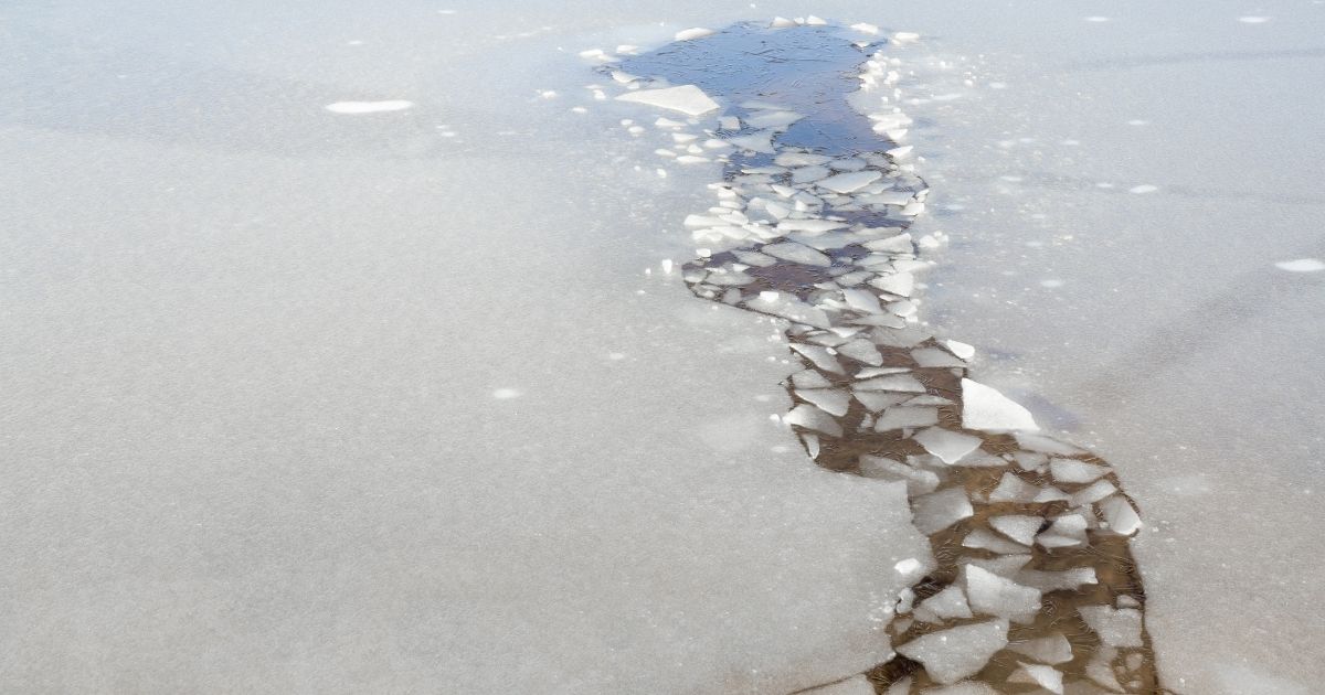 A stock photo of thin ice is seen above.
