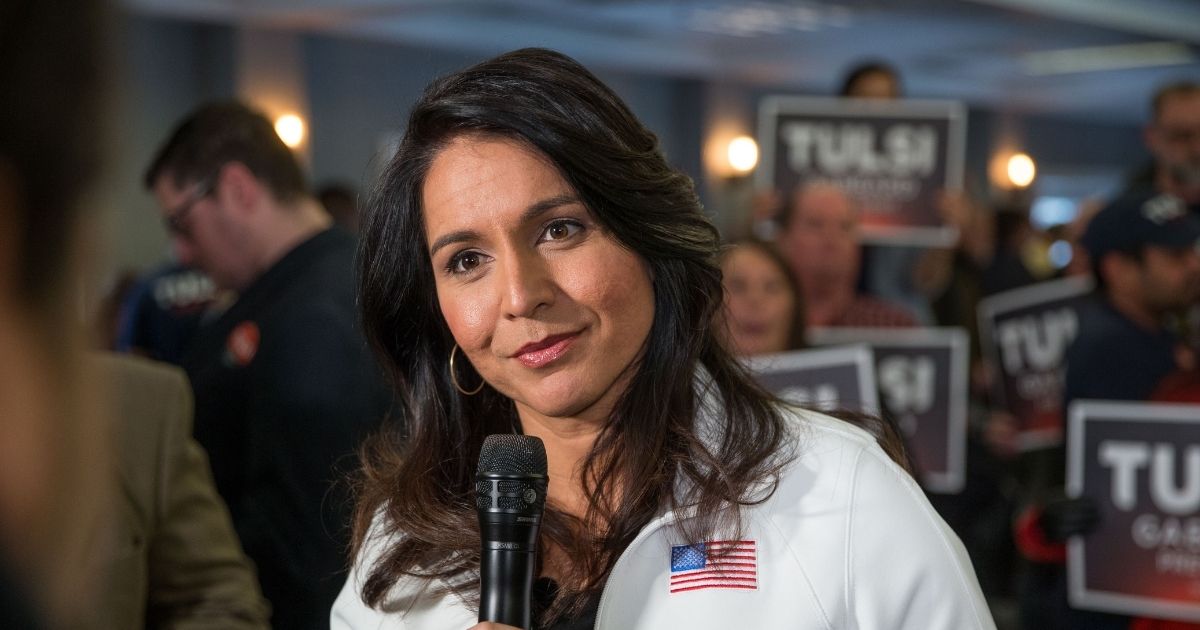 Democratic presidential candidate Rep. Tulsi Gabbard of Hawaii answers media questions following a campaign event on Feb. 9, 2020, in Portsmouth, New Hampshire.