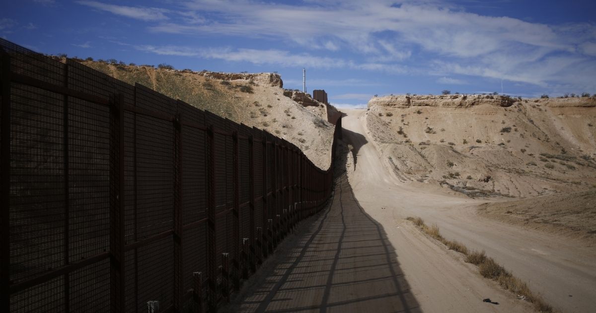 The above photo shows a border fence that separates the U.S. and Mexico in New Mexico.