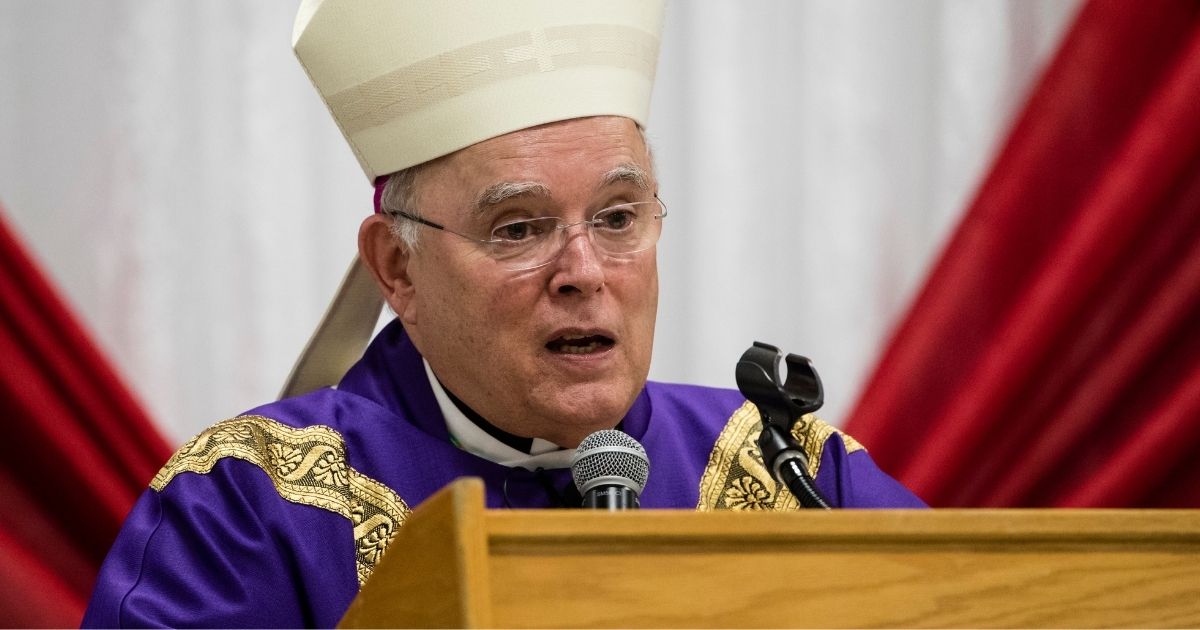 Then-Philadelphia Archbishop Charles Chaput celebrates Mass with inmates at the Curran-Fromhold Correctional Facility in Philadelphia in December 2017.