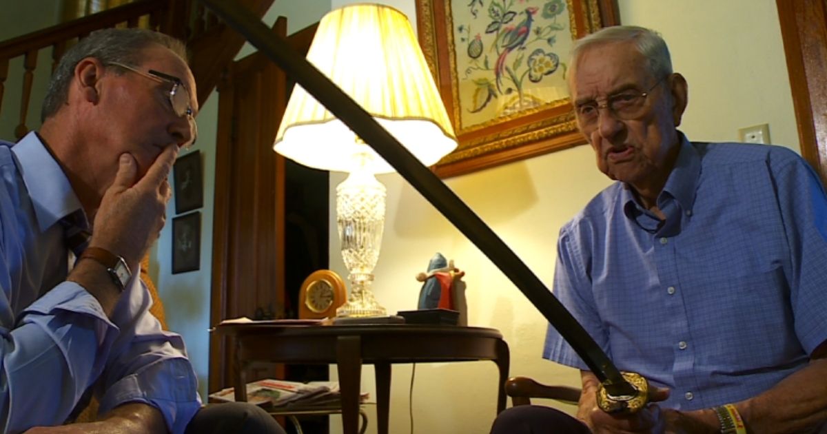 Marine Corps veteran Orville Amdahl of Lanesboro, Minnesota, holds the Samurai sword he got from a Japanese soldier in 1945 during an interview with WCCO-TV in Minneapolis.