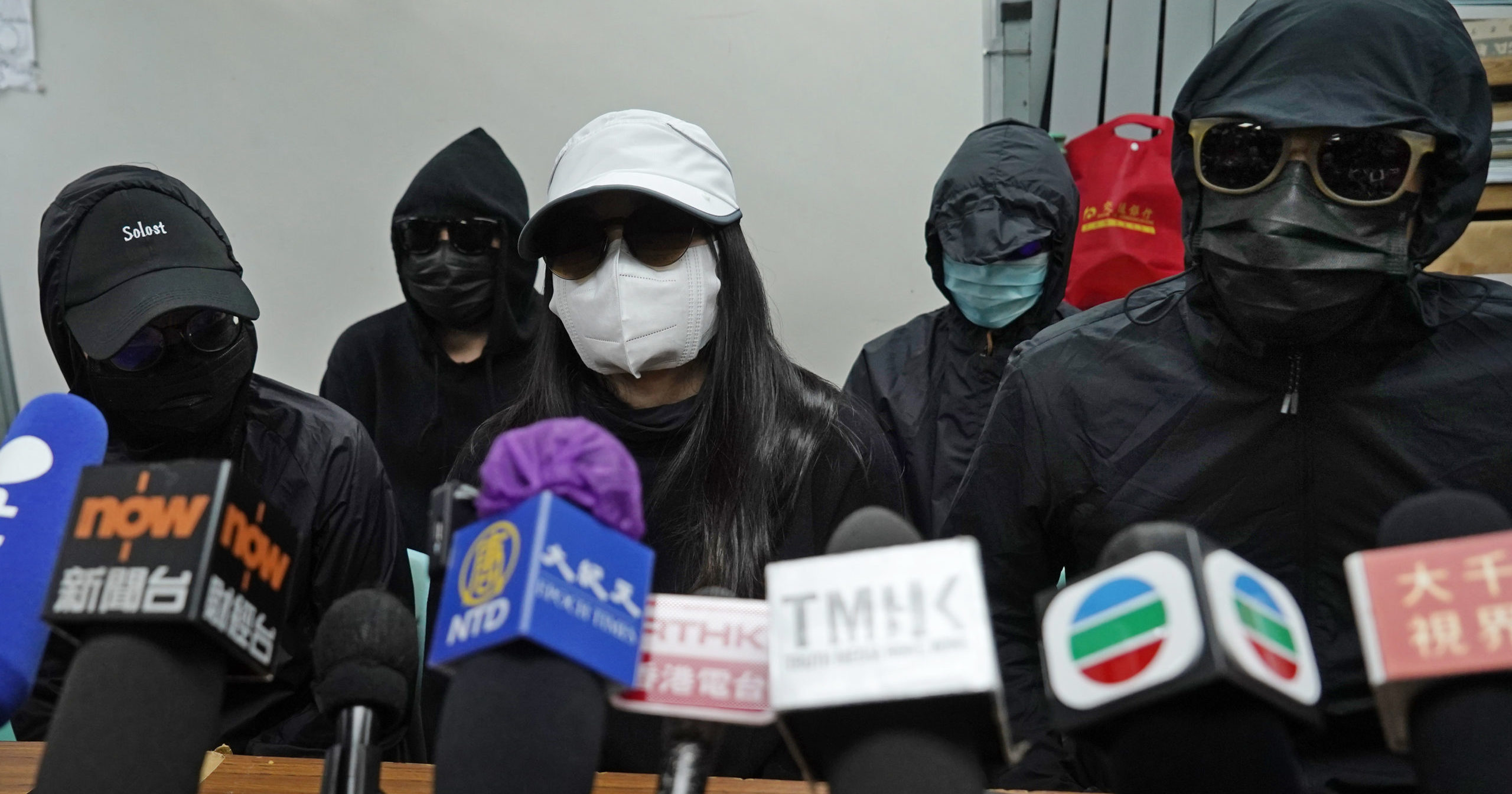 Relatives of 12 Hong Kong activists detained at sea by Chinese authorities attend a news conference in Hong Kong on Dec. 28, 2020.