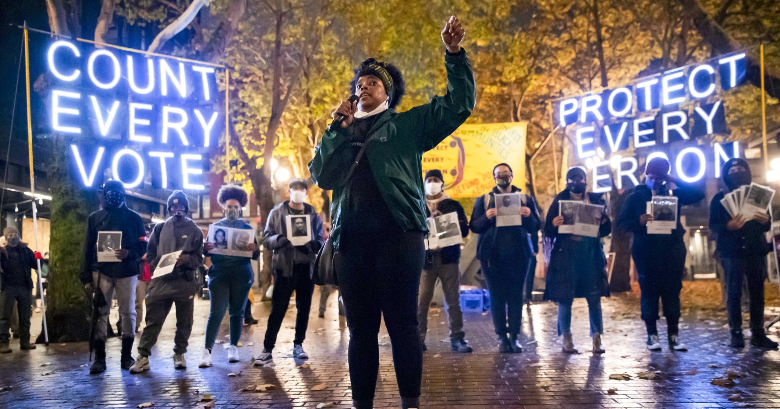 In this Nov. 4, 2020, file photo, Travonna Thompson-Wiley with the Black Action Coalition speaks at a rally and march in Occidental Park in Seattle. The coalition demanded, among other things, the elimination of the Electoral College.
