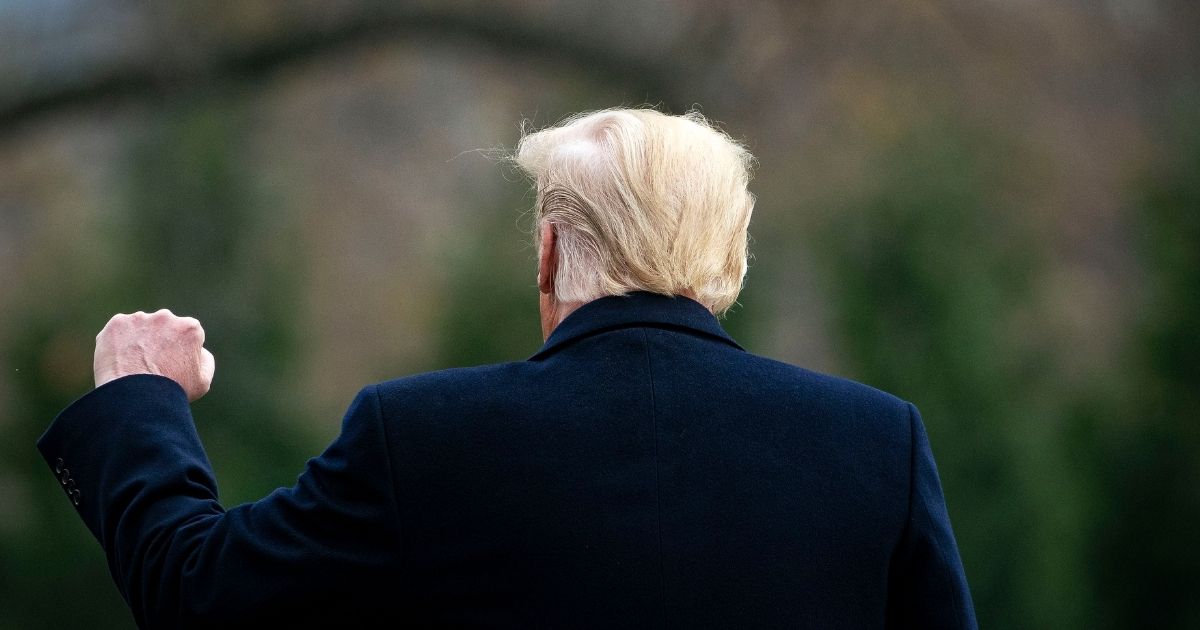 President Donald Trump pumps his fist as he walks on the South Lawn of the White House on Dec. 12, 2020, in Washington, D.C.