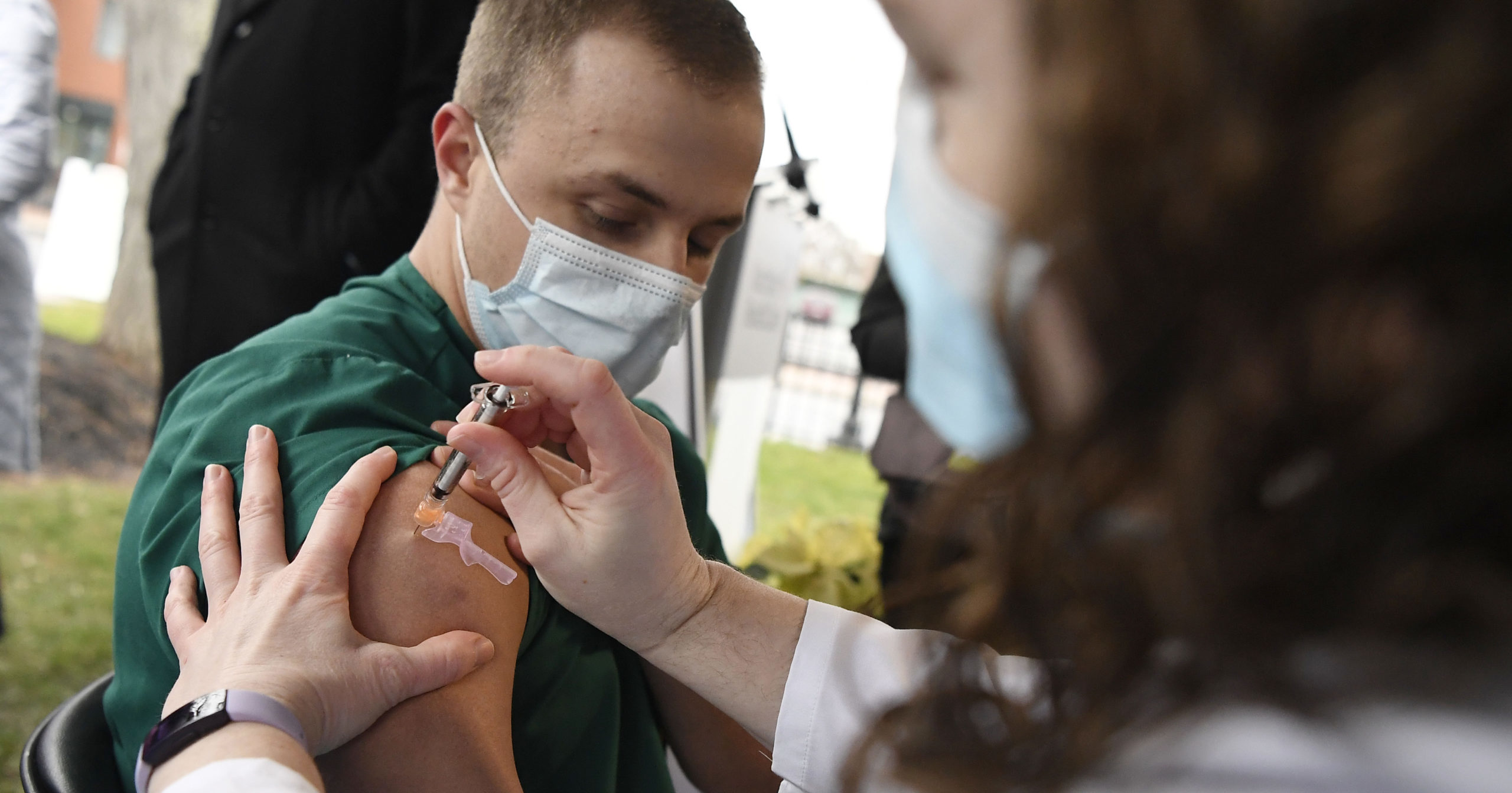 A health care worker administers the Pfizer-BioNTech COVID-19 vaccine outside of Hartford Hospital on Dec. 14, 2020, in Hartford, Connecticut.