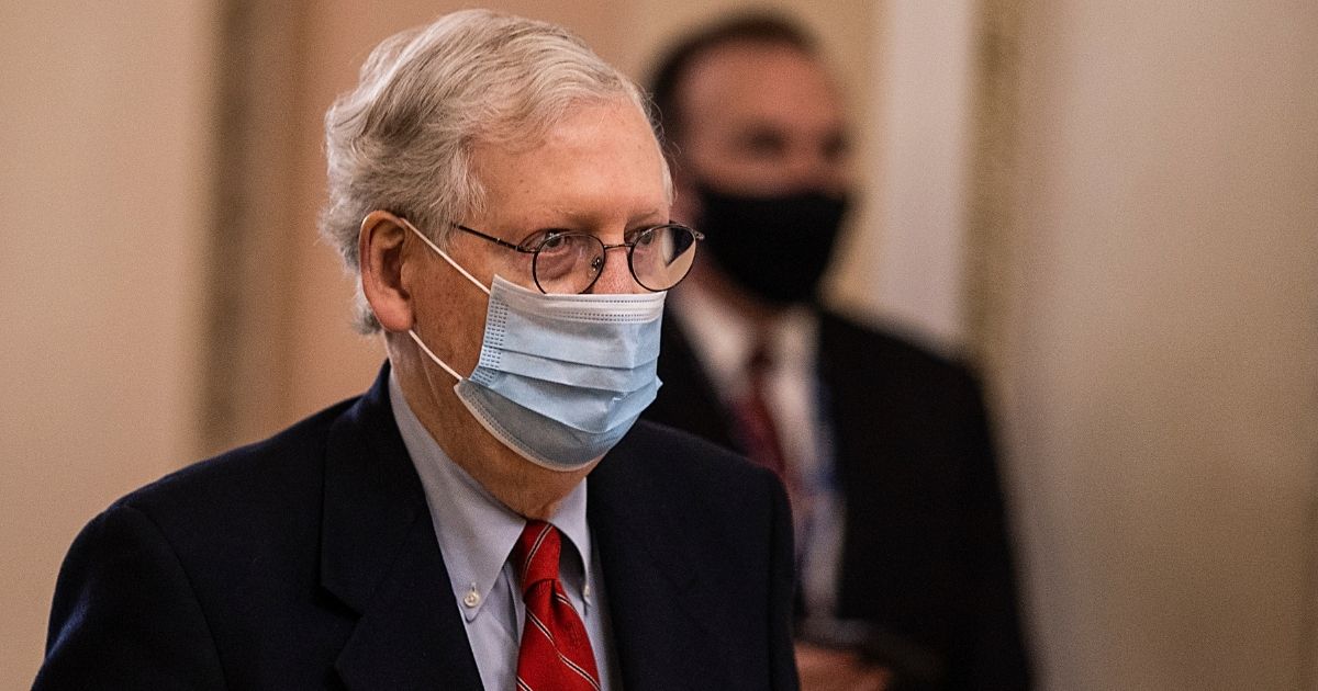 Senate Majority Leader Mitch McConnell walks in Capitol Hill on Dec. 20, 2020, in Washington, D.C.