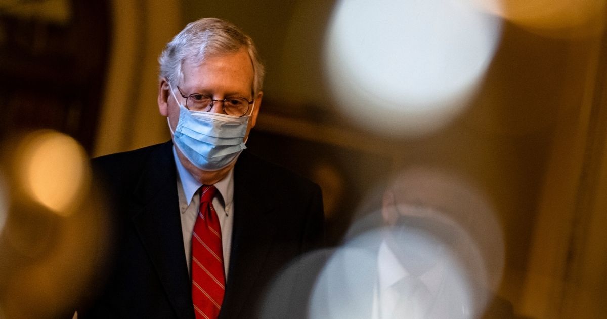 Senate Majority Leader Mitch McConnell heads to his office from the floor of the Senate on Dec. 20, 2020, in Washington, DC.