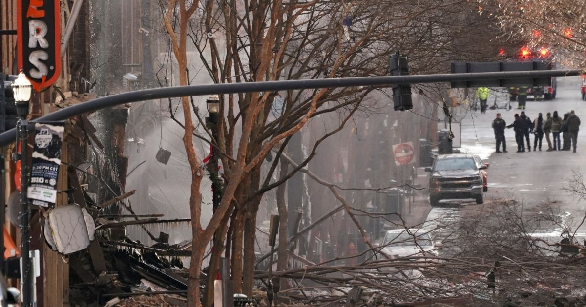 Emergency personnel work at the scene of an explosion in downtown Nashville, Tennessee, on Friday. Buildings shook in the immediate area and beyond after a loud boom was heard early Christmas morning.