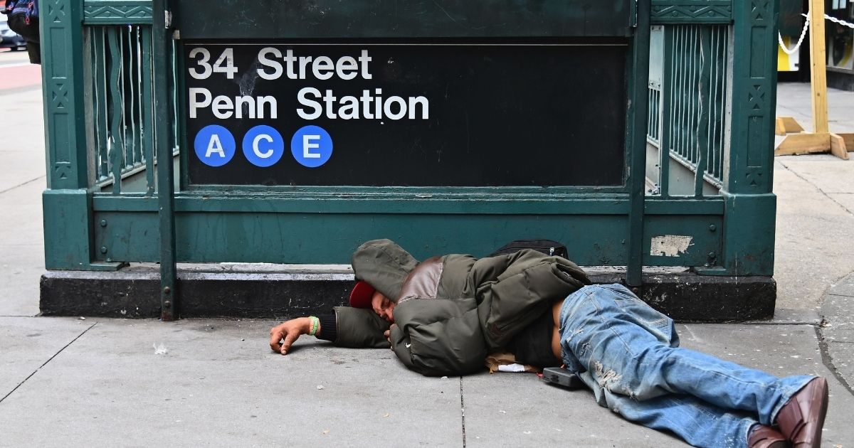A man sleeps near Penn Station on Sept. 17, 2020, in New York City.