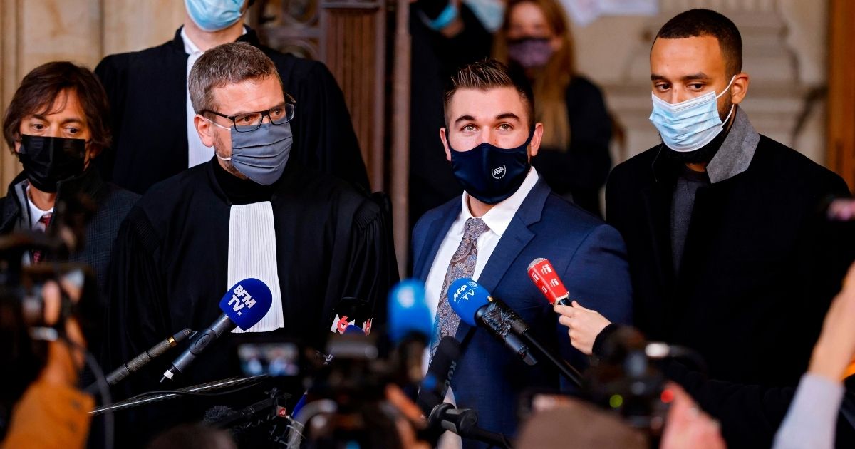 From left to right, French-American professor Mark Magoolian, French lawyer Thibault de Montbrial, US former serviceman Alek Skarlatos and US national Anthony Sadler speak to the media at a courthouse in Paris on Nov. 20, 2020, on the second day of the trial of Ayoub El Khazzani, a Moroccan man whose attempted terror attack on a train in 2015 was foiled by passengers.
