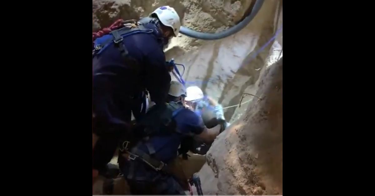 First responders pull a 4-year-old boy out of a well in Garceno, Texas.