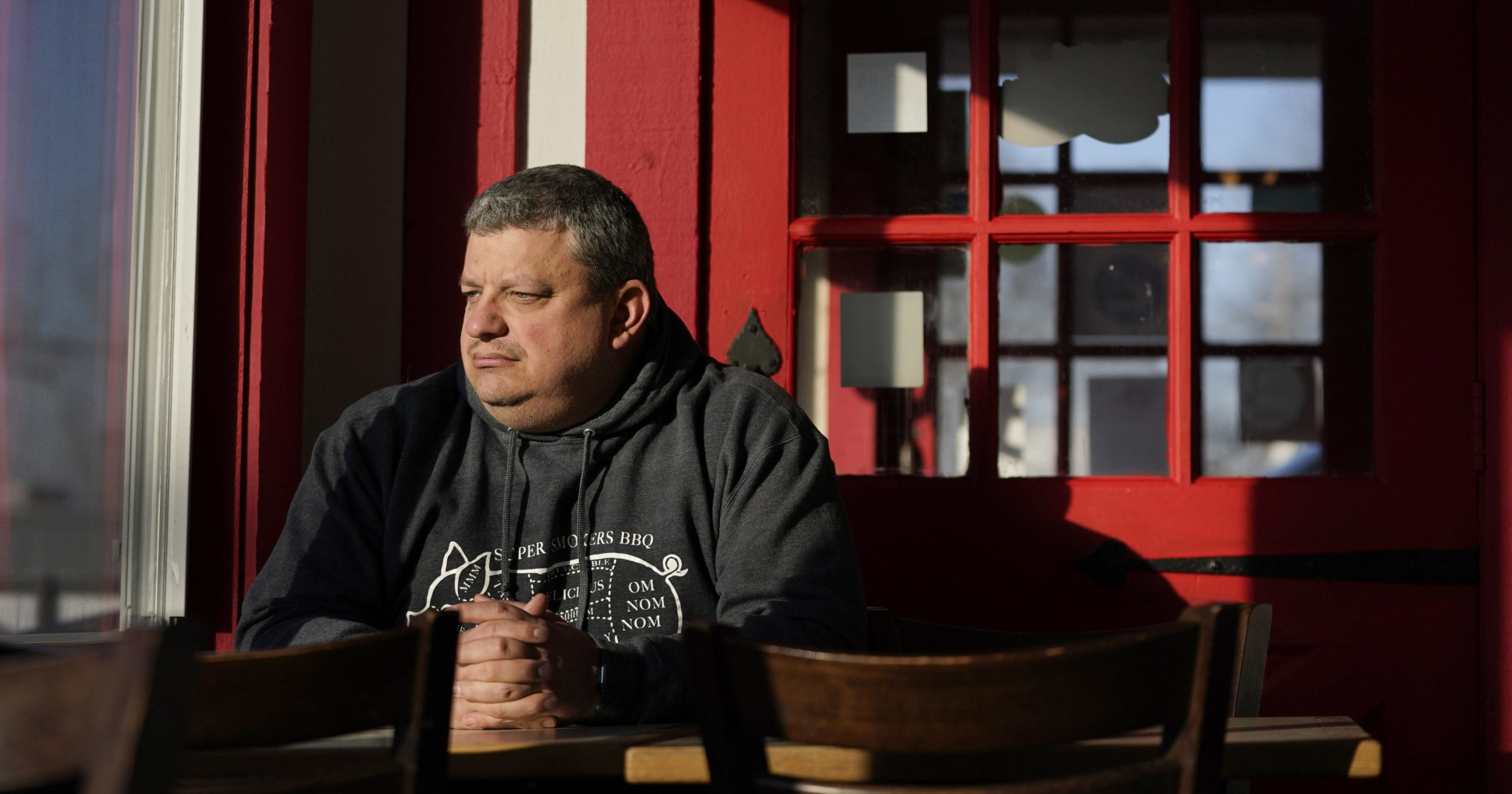 Jeff Fitter, owner of Super Smokers BBQ, poses for a photo inside his restaurant on Jan. 28, 2021, in Eureka, Missouri. Fitter says his profits were down by about half last year due to the closures and capacity limits imposed by St. Louis County.