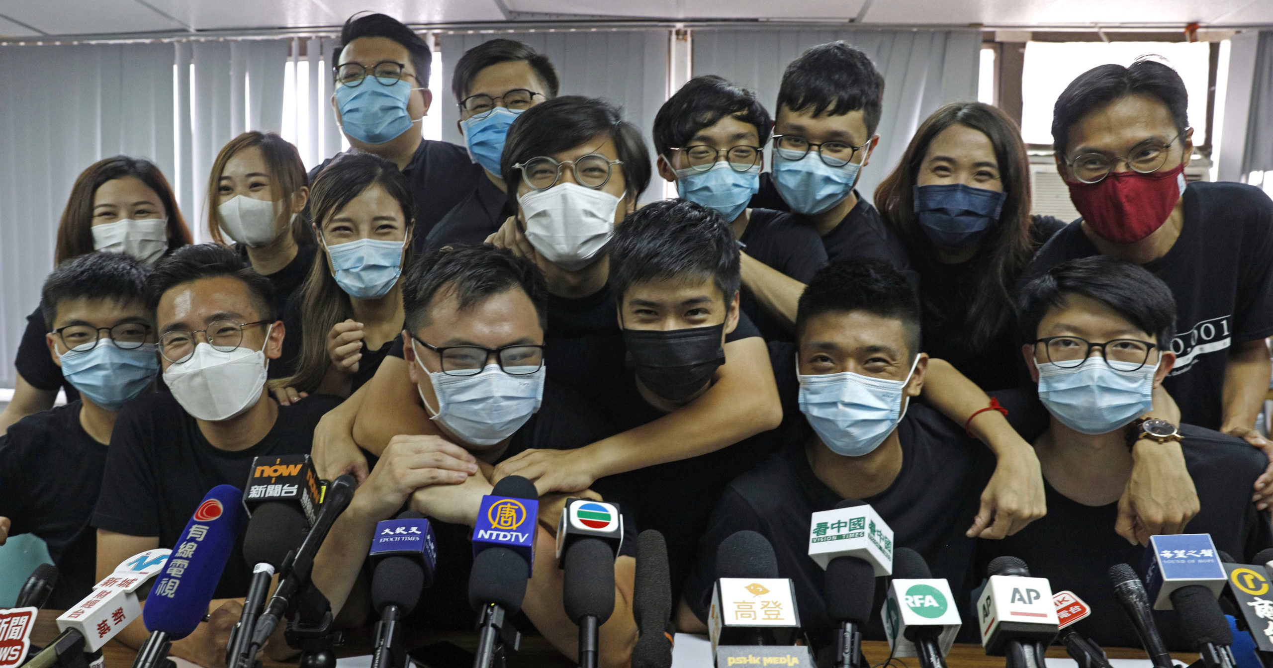Pro-democracy activists who were elected in unofficial pro-democracy primaries attend a news conference in Hong Kong on July 15, 2020.