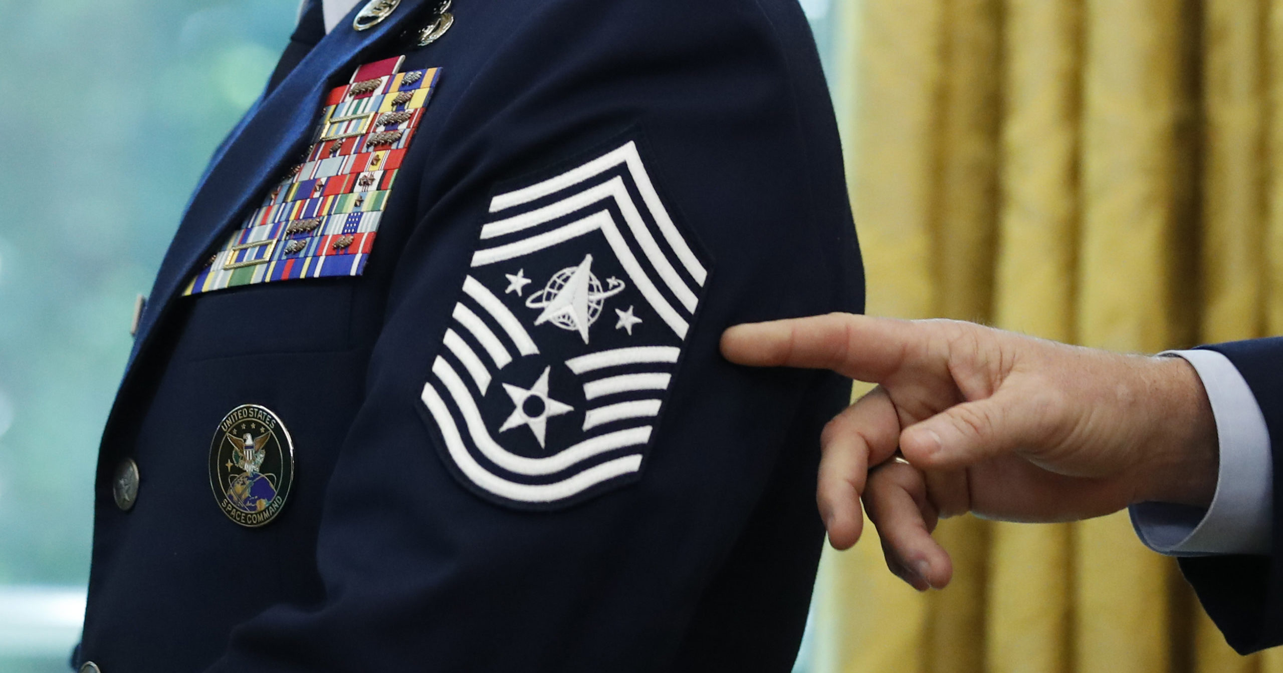Chief Master Sgt. Roger Towberman displays his insignia during a presentation of the United States Space Force flag in the Oval Office of the White House in Washington, D.C., on May 15, 2020.