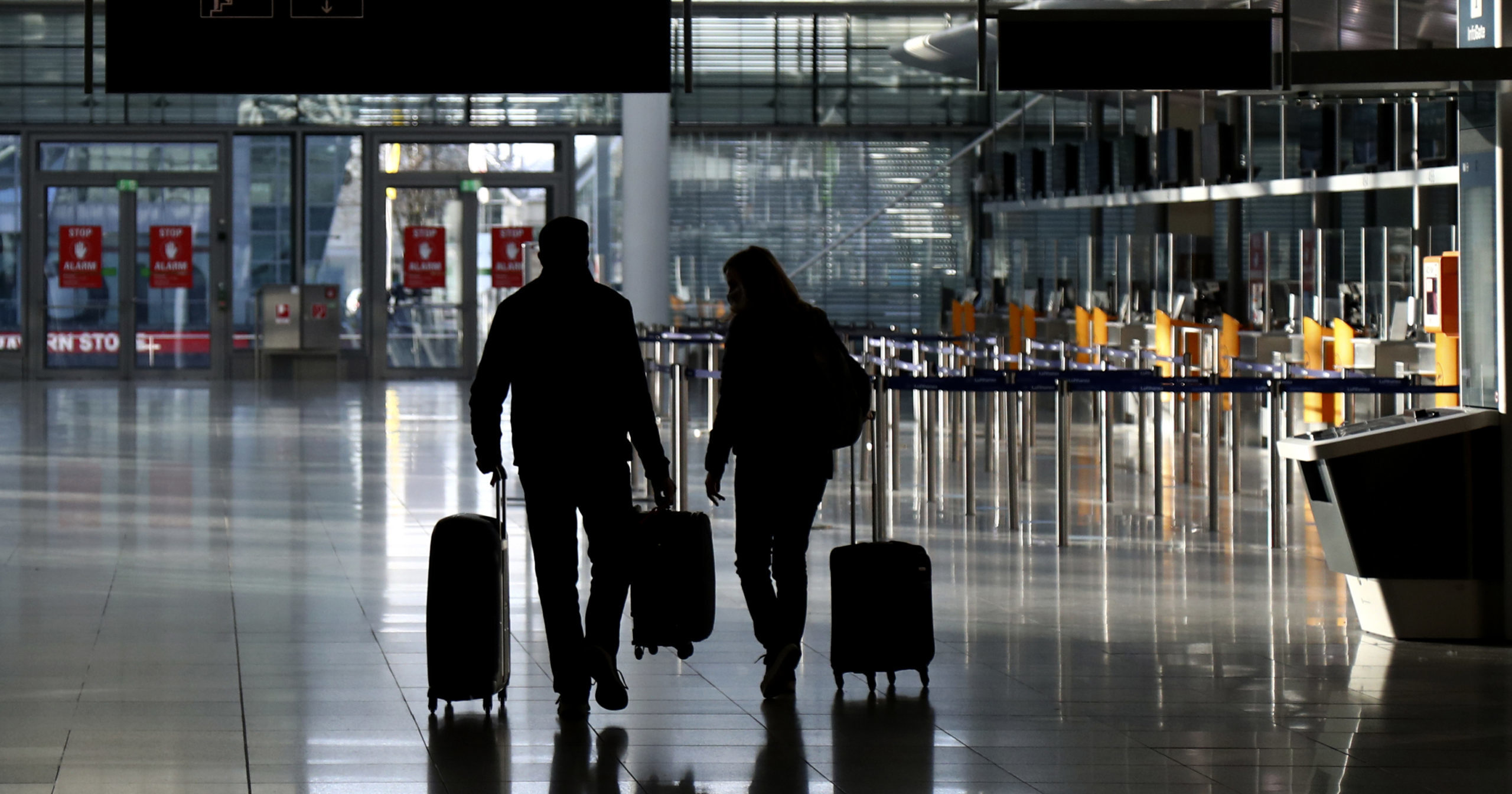 People walk through the airport in Munich, Germany, on Dec. 26, 2020.