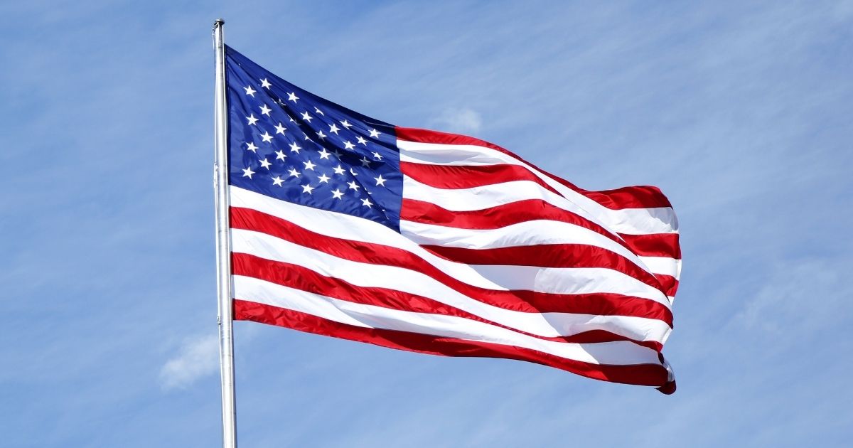 The U.S. flag flies from a flagpole.
