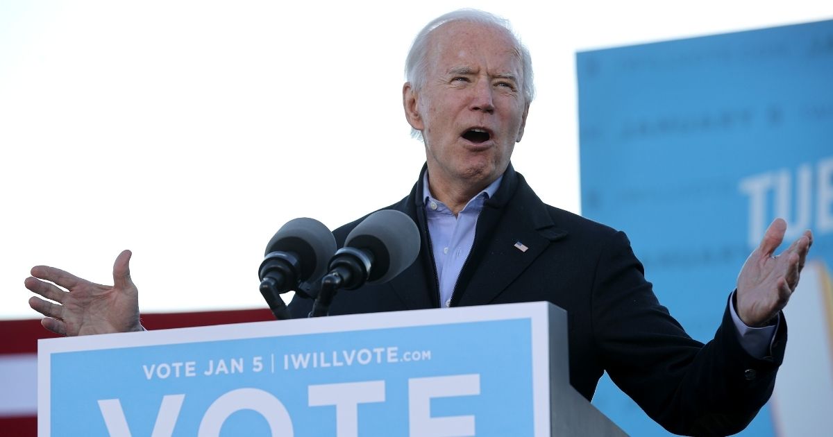 Presumptive President-elect Joe Biden speaks during a campaign rally for Democratic Senate candidates Jon Ossoff and the Rev. Raphael Warnock in the parking lot of Center Parc Stadium in Atlanta on Monday.
