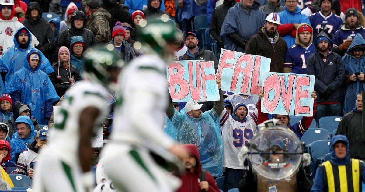 Fans hold up signs during the first quarter of an NFL game between the Buffalo Bills and the New York Jets at New Era Field on Dec. 29, 2019, in Orchard Park, New York.