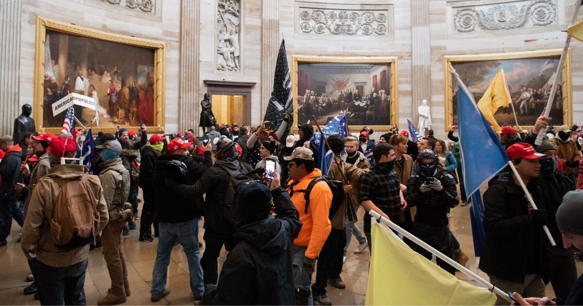 Rioters walk around in the Capitol Rotunda after breaching the U.S. Capitol on Jan. 6, 2021, in Washington, D.C.