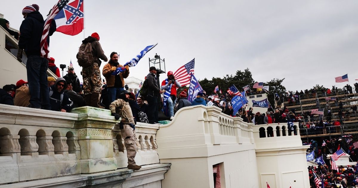 Thousands of Donald Trump supporters storm the United States Capitol building following a “Stop the Steal” rally in Washington, D.C., on Wednesday.