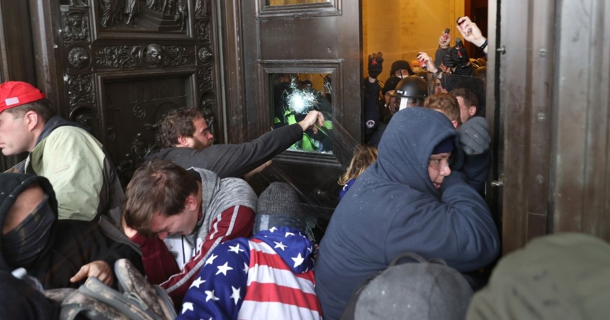 Rioters attempt to enter the U.S. Capitol Building in Washington, D.C., on Wednesday.