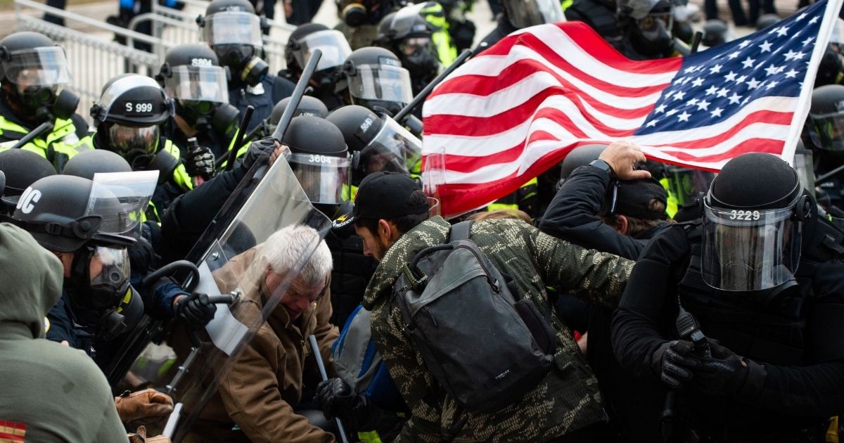 Rioters clash with police officers outside the Capitol in Washington on Wednesday.
