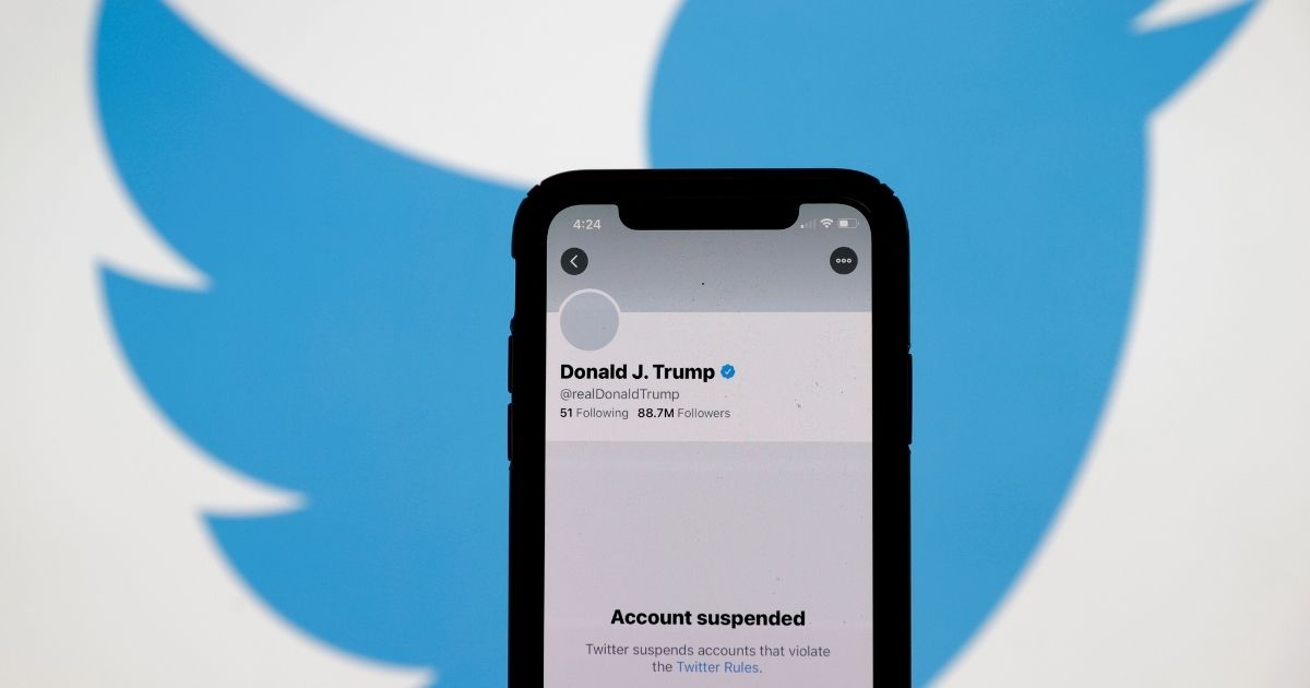 The suspended Twitter account of US President Donald Trump appears on an iPhone screen on January 08, 2021 in San Anselmo, California. Citing the risk of further incitement of violence following an attempted insurrection on Wednesday, Twitter permanently suspended President Donald Trump's account.