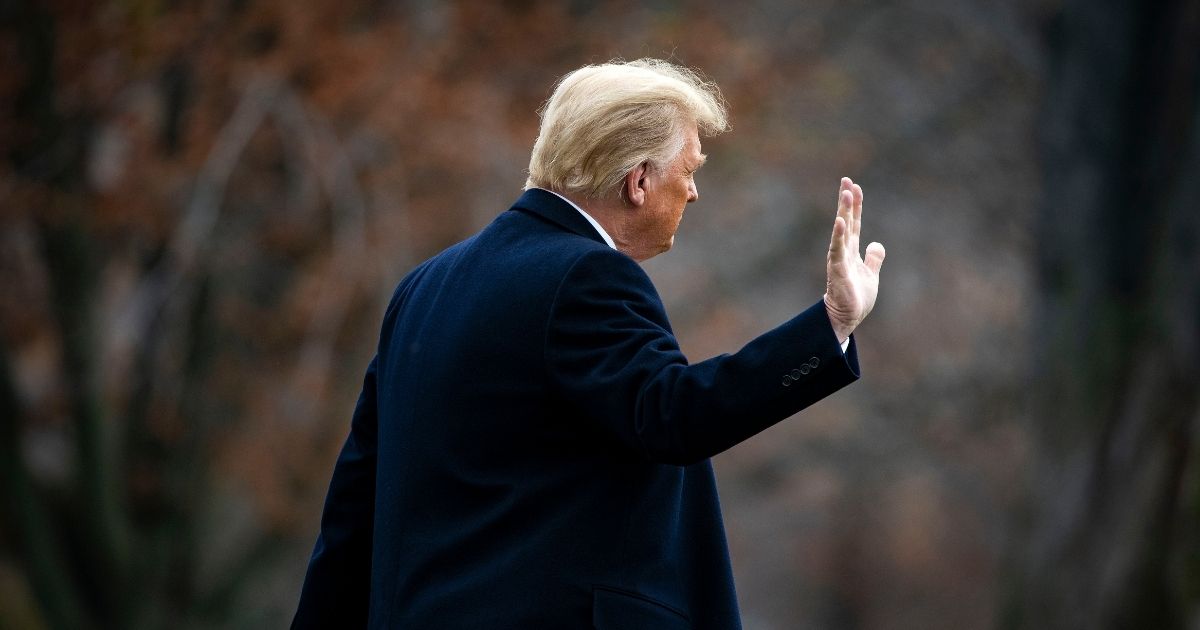 President Donald Trump waves as he departs on the South Lawn of the White House on Dec. 12, 2020, in Washington, D.C.