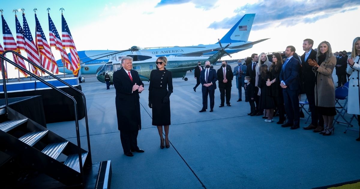 Then-President Donald Trump and then-first lady Melania Trump arrive to speak to supporters prior to boarding Air Force One to head to Florida on Wednesday in Joint Base Andrews, Maryland.