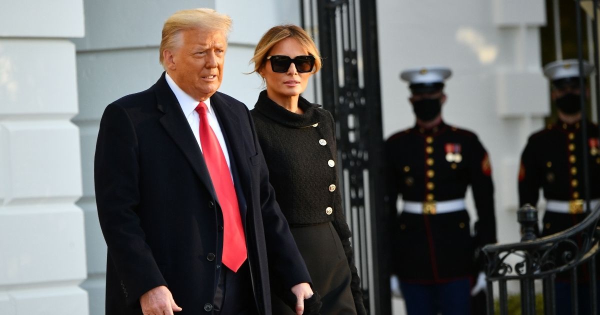 Then-President Donald Trump and then-first lady Melania Trump make their way to board Marine One before departing from the South Lawn of the White House in Washington, D.C., on Wednesday.