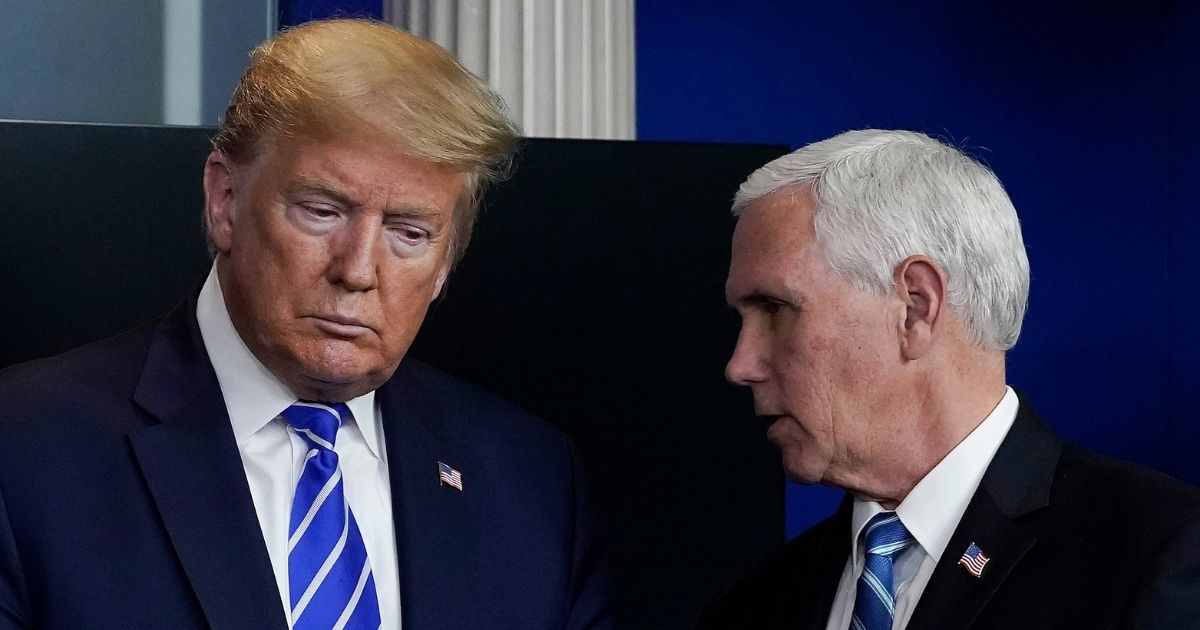President Donald Trump, left, and Vice President Mike Pence confer at the White House on April 23, 2020, in Washington, D.C.