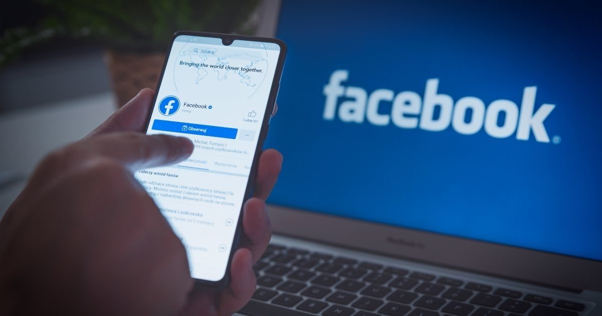 A person downloading the Facebook app is pictured in the stock image above.