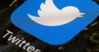 The Twitter logo is seen above.