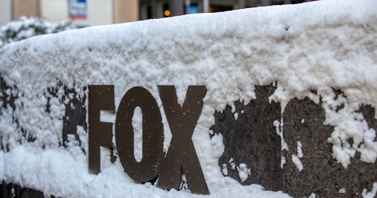 The Fox logo sign is covered in snow outside the News Corp. building in New York City on Dec. 17.
