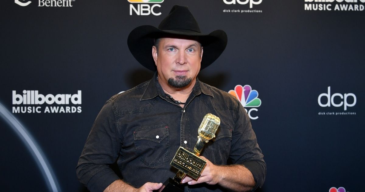Garth Brooks poses with the Icon Award backstage at the 2020 Billboard Music Awards, broadcast on Oct. 14, 2020, at the Dolby Theatre in Los Angeles.