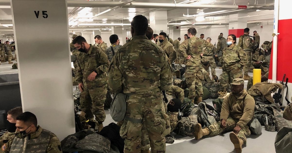 National Guard troops rest in a parking garage in D.C.