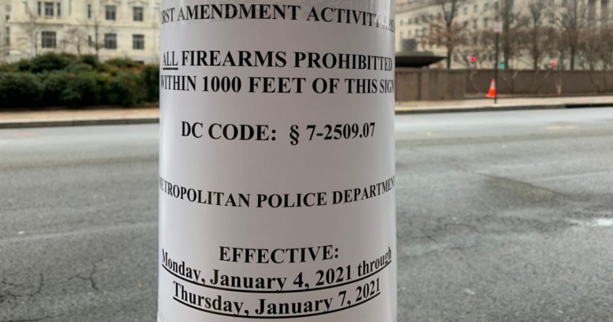 Signs banning guns within 1,000 feet are set up around Washington, D.C. by police in preparation for pro-Trump protesters.