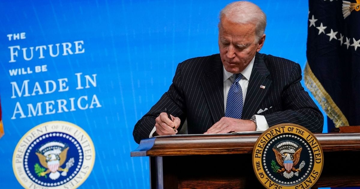 President Joe Biden signs an executive order related to American manufacturing in the South Court Auditorium of the White House complex on Monday in Washington, D.C.