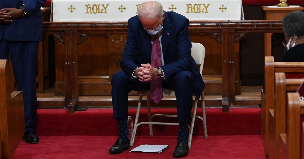 Presidential candidate Joe Biden prays as he meets religious leaders at Bethel AME Church in Wilmington, Delaware, on June 1, 2020.