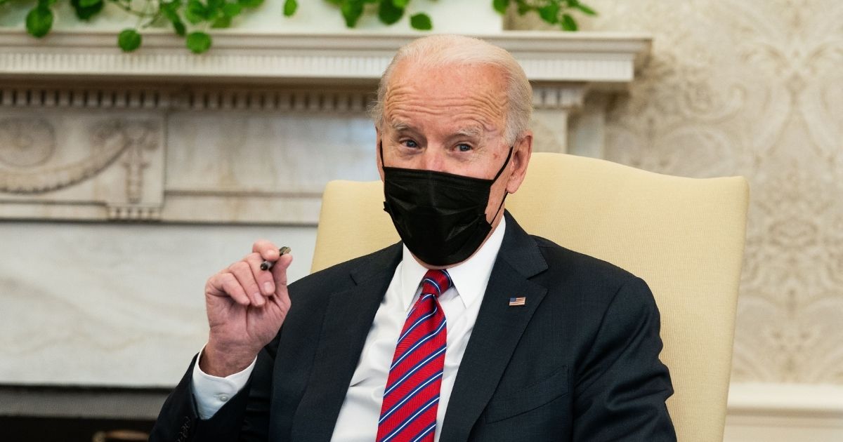 Joe Biden speaks in the Oval Office