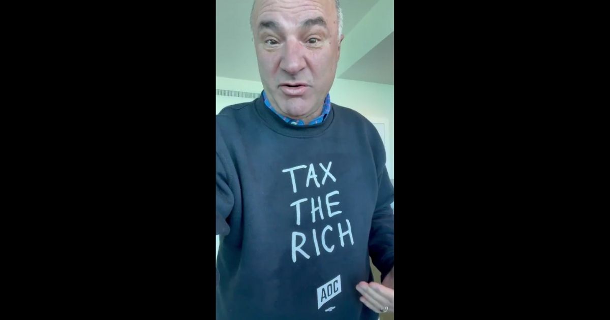 "Shark Tank" star Kevin O'Leary poked fun at Alexandria Ocasio-Cortez in a Twitter video while sporting her "Tax the Rich" sweatshirt on Thursday.