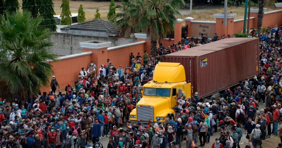 Migrants who arrived in a caravan from Honduras on their way to the United States are blocked by security foces in Vado Hondo, Guatemala, on Monday.