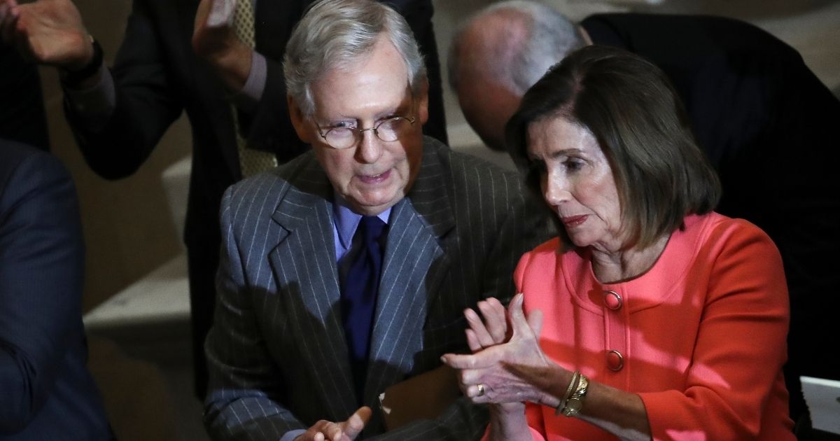 Speaker of the House Nancy Pelosi and Senate Majority Leader Mitch McConnell, left, briefly speak with each other as they attend a Congressional Gold Medal ceremony at the U.S. Capitol on Jan. 15, 2020, in Washington, D.C.