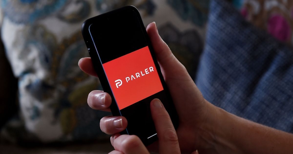 The Parler social media app logo is displayed on a smartphone in Arlington, Virginia, on July 2, 2020.