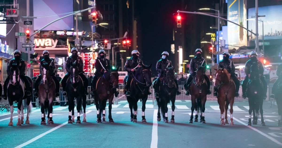 NYPD's Mounted Unit patrol officers ride their horses during 2021 New Year's Eve celebration in Times Square on December 31, 2020 in New York City.